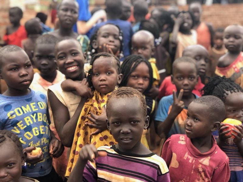 Community members in Cameroon engaged in everyday life and mutual support