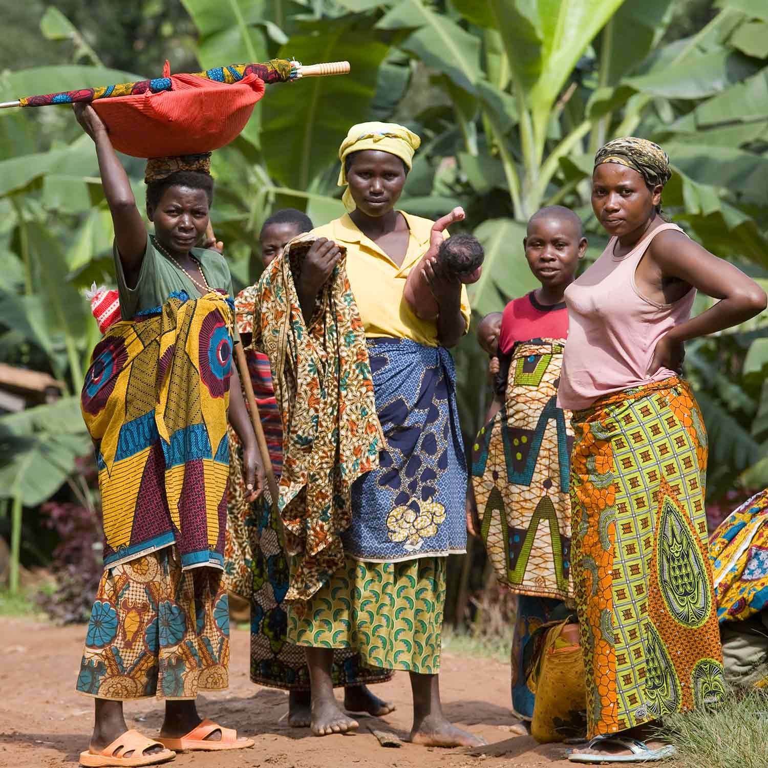 Community members — women, children and families — in everyday settings of dignity and agency